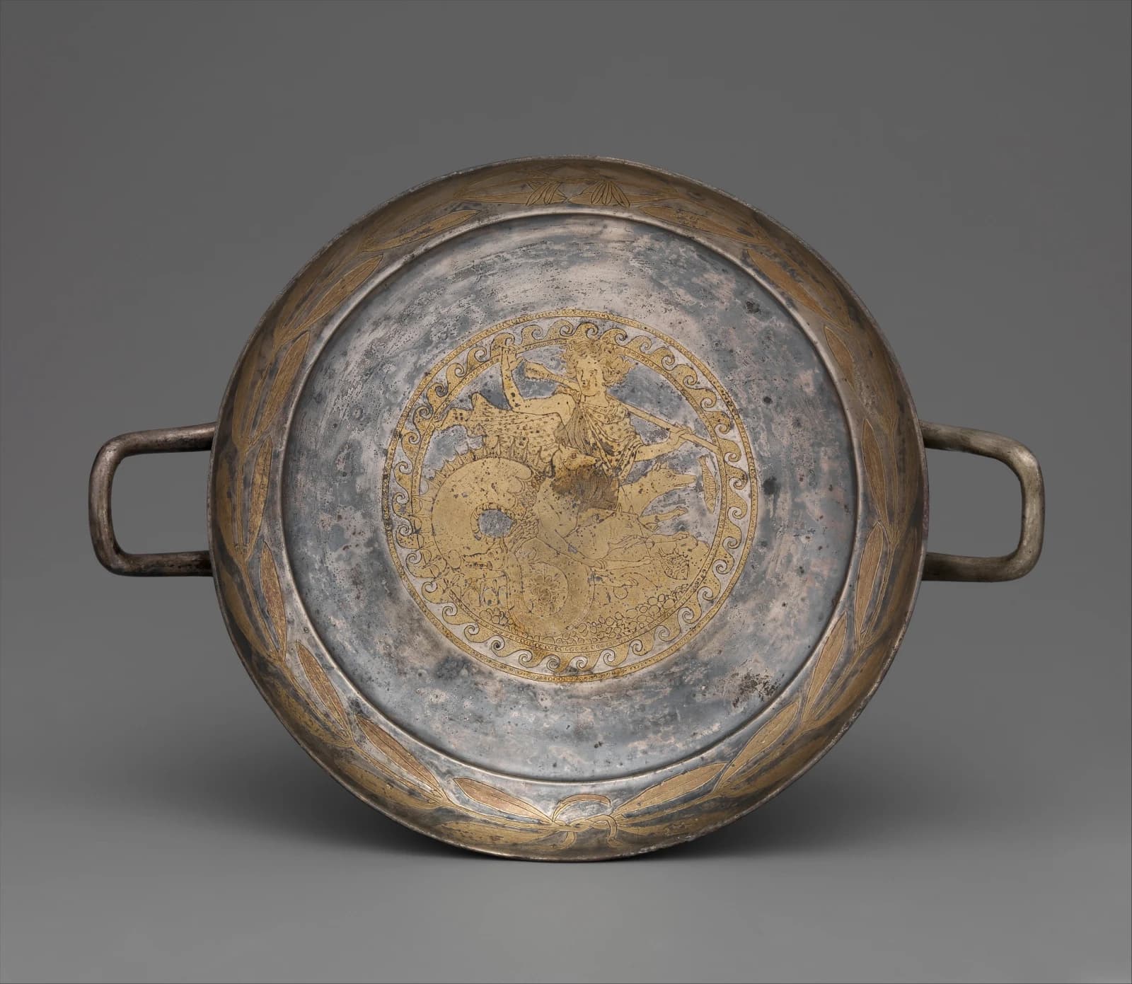 Scylla on the tondo of a late fifth-century BCE gilt-silver kylix